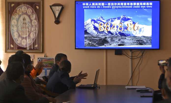 New height of Everest is 8848.86 meters